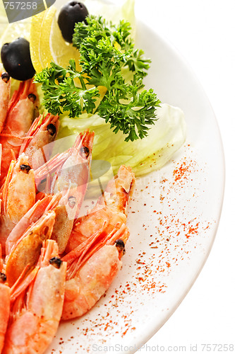 Image of Shrimps dressed with greens and lemons