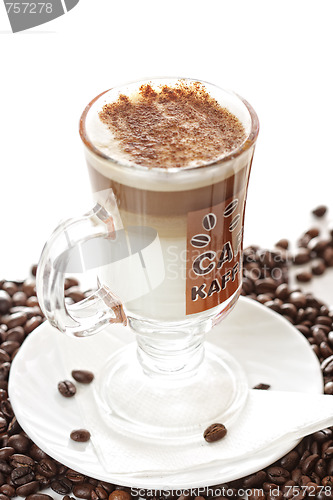 Image of Cup of latte coffee on beans