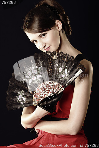 Image of Young woman and fan