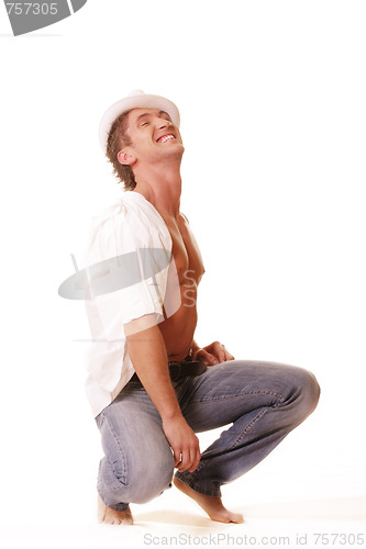 Image of Guy in hat squating