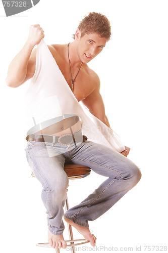 Image of Guy on chair tearing shirt