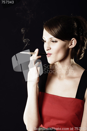 Image of Smoking young woman in red