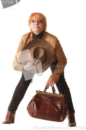 Image of Redhead traveler bending forward