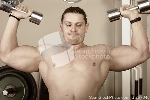 Image of Guy with dumbbells