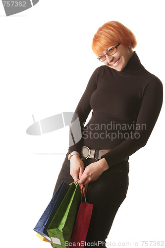 Image of Smiling redhead with color bags