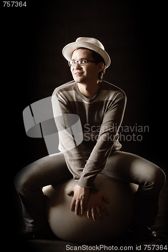 Image of Funy guy sitting on ball