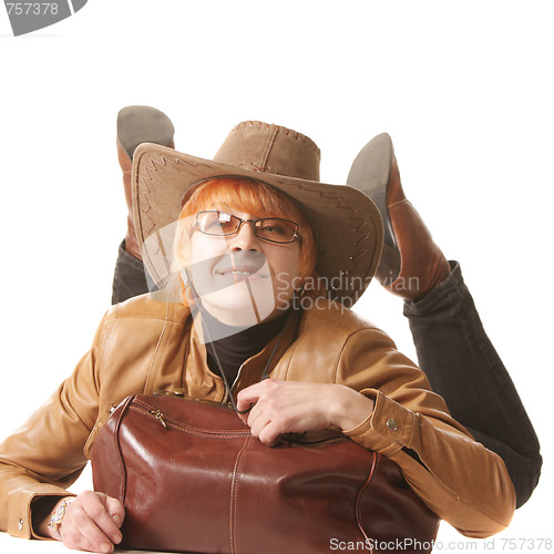 Image of Redhead traveler laying down on bag