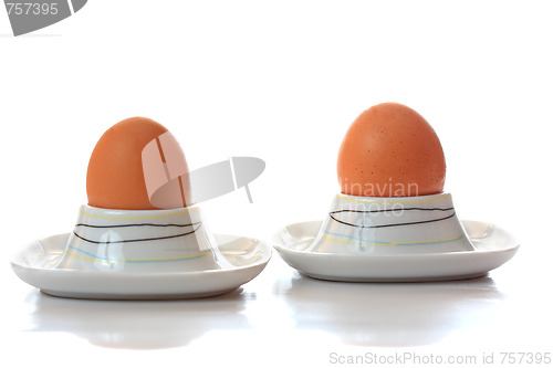 Image of Two eggs in eggcups reflecting