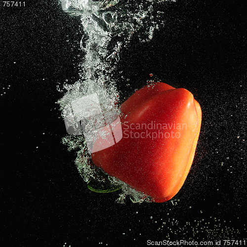 Image of Red paprika in dark water