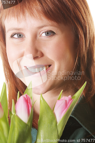 Image of Positive redhead with pink tulips