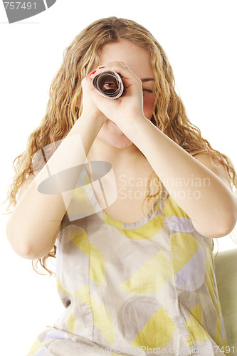 Image of Woman looks through scrolled paper