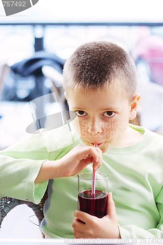 Image of Kid with cold drink