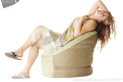 Image of Woman in chair looks up