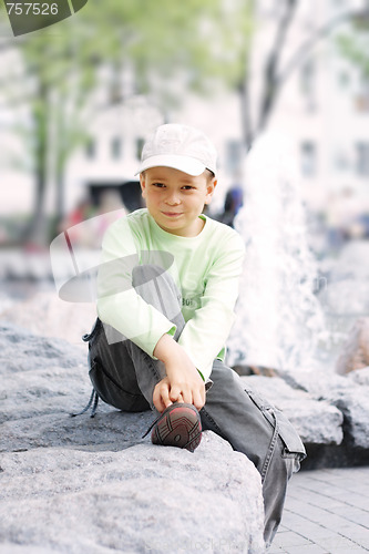 Image of Boy outdoors in sunny day