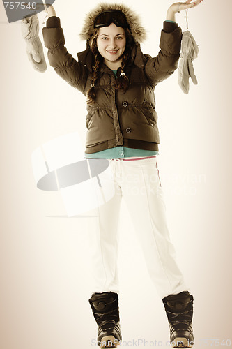 Image of Woman in brown with raised hands