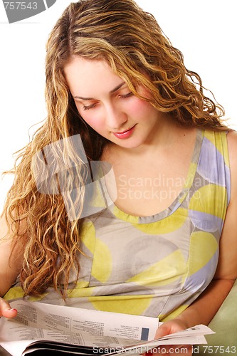 Image of Woman reading paper