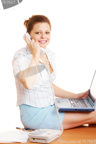 Image of Woman sitting on table