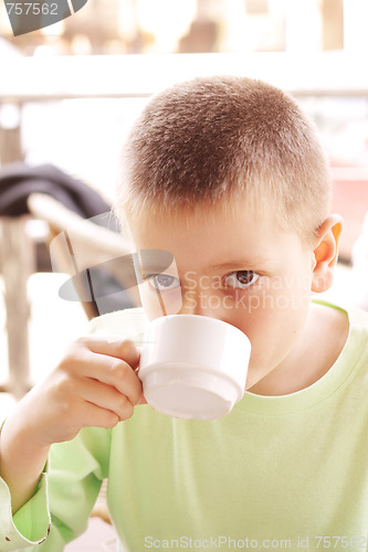Image of Boy with hot drink