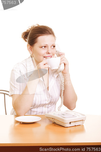 Image of Woman with cup talking on phone