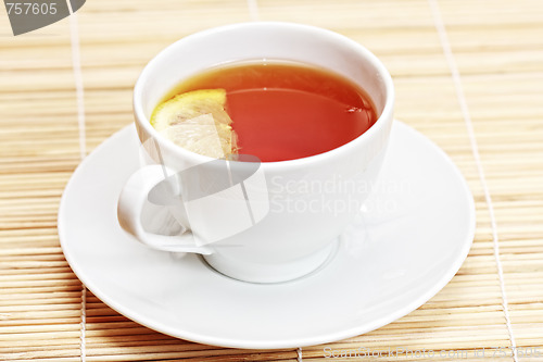 Image of White cup of tea with lemon
