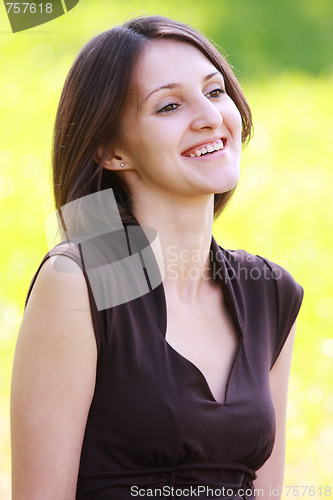 Image of Smiling brunette in brown