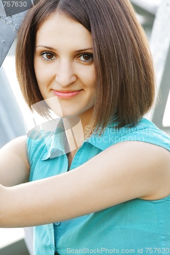 Image of Woman in turquoise blouse