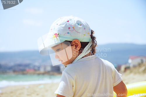 Image of Girl on beach sideview