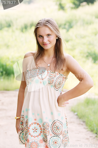 Image of Young woman in sundress