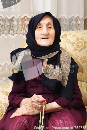 Image of Senior woman counting beads