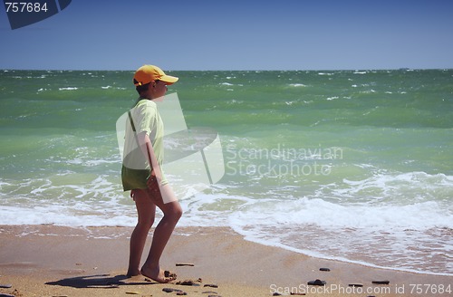 Image of Boy standing at sea