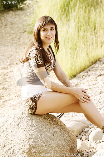 Image of Brunette on stone