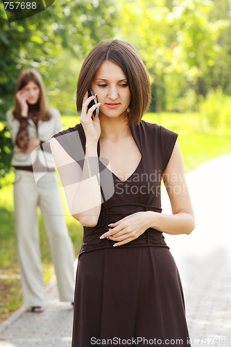 Image of Women talks on phone