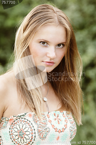 Image of Pretty girl in sun-dress