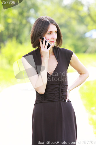 Image of Woman with phone on road