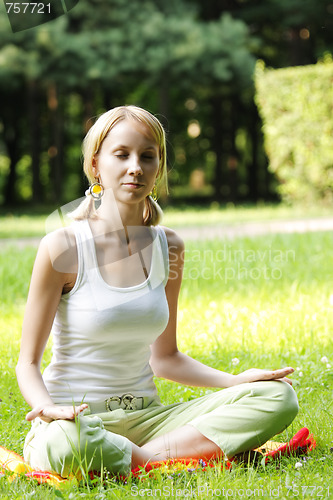 Image of Blonde in yoga pose