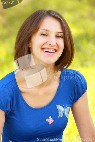 Image of Smiling brunette in blue