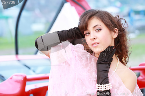 Image of Young woman in black gloves