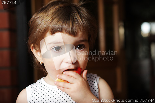 Image of Girl eating peach