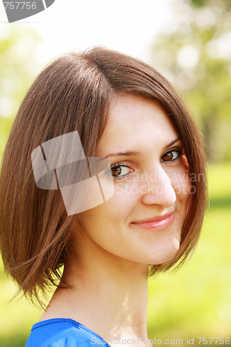 Image of Smiling woman in sunlight
