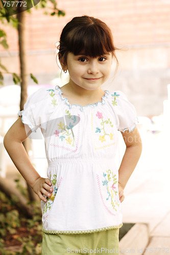 Image of Girl with hands at waist