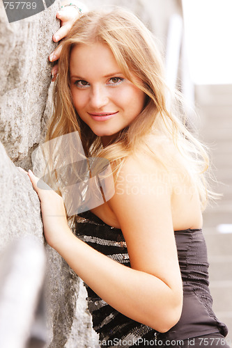 Image of Blonde leaning against wall