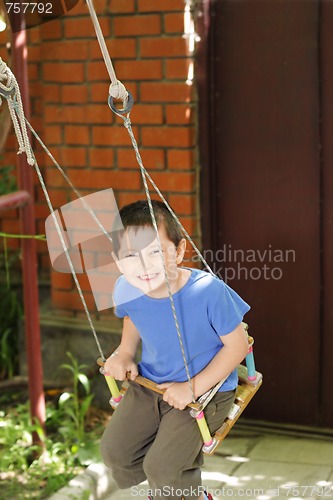 Image of Boy on swings