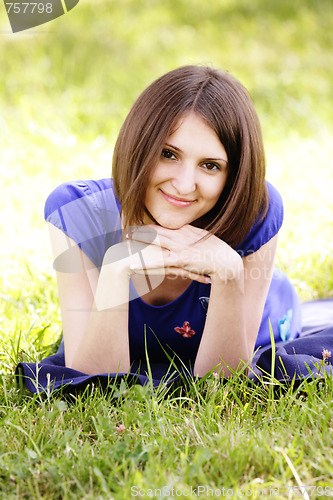 Image of Woman in blue and grass