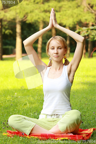 Image of Relaxed blonde in yoga pose