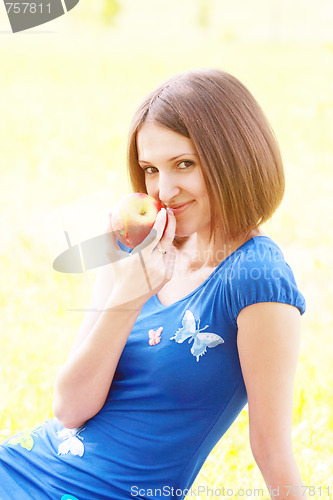 Image of Woman with red apple