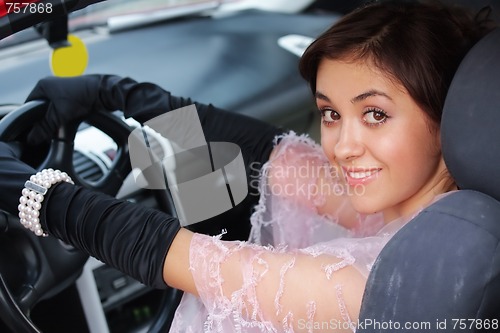 Image of Smiling brunette in car