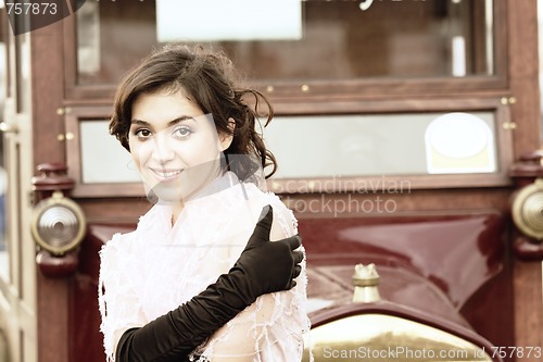 Image of Smiling woman and retro car