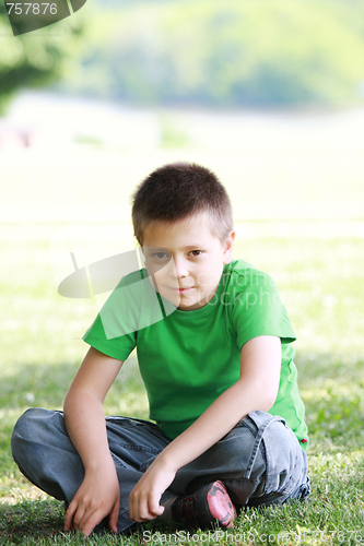 Image of Serene boy in casual on grass