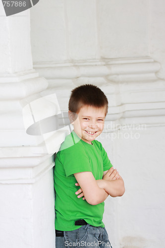 Image of Smiling boy hands folded