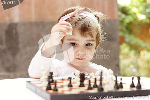 Image of Girl playing chess
